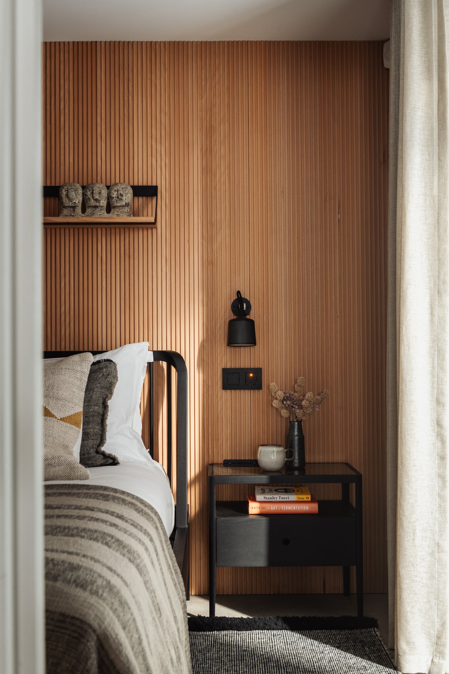 Side of bed in contemporary Japandi styled bedroom with fluted wall panels by Element