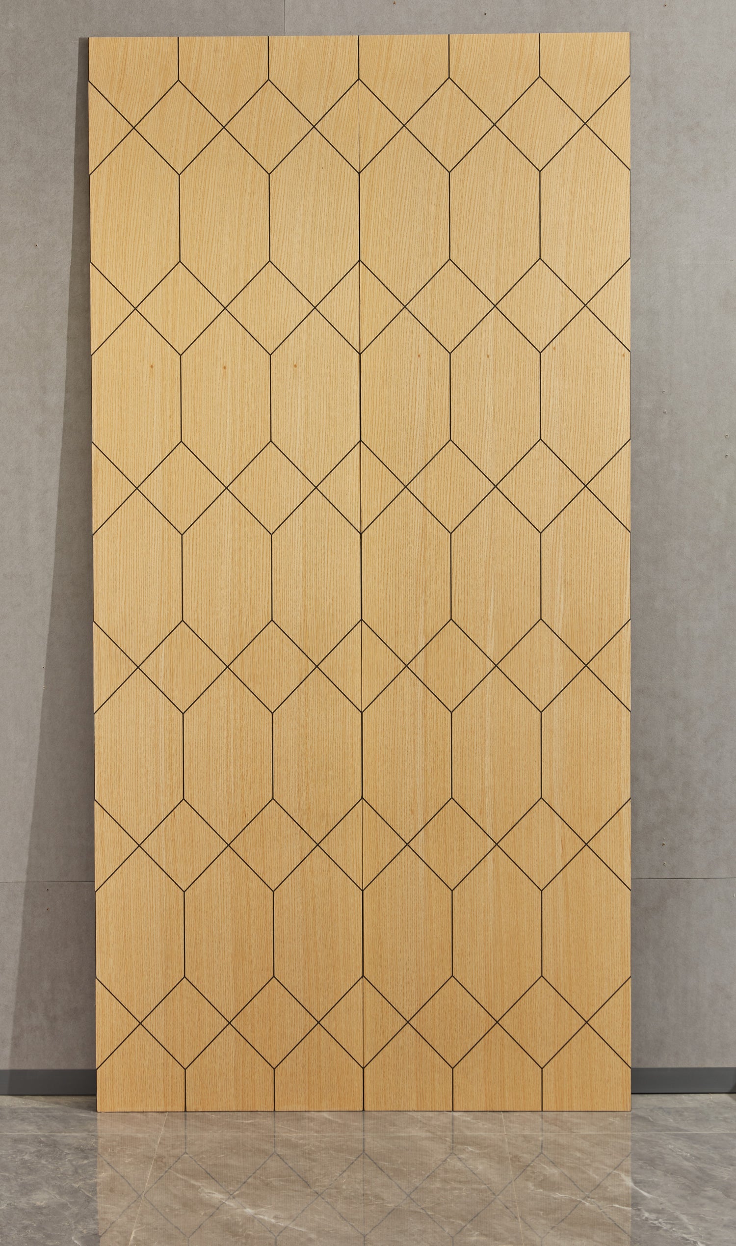 Two geometric bambu wall panels by Element, leaning against a wall.