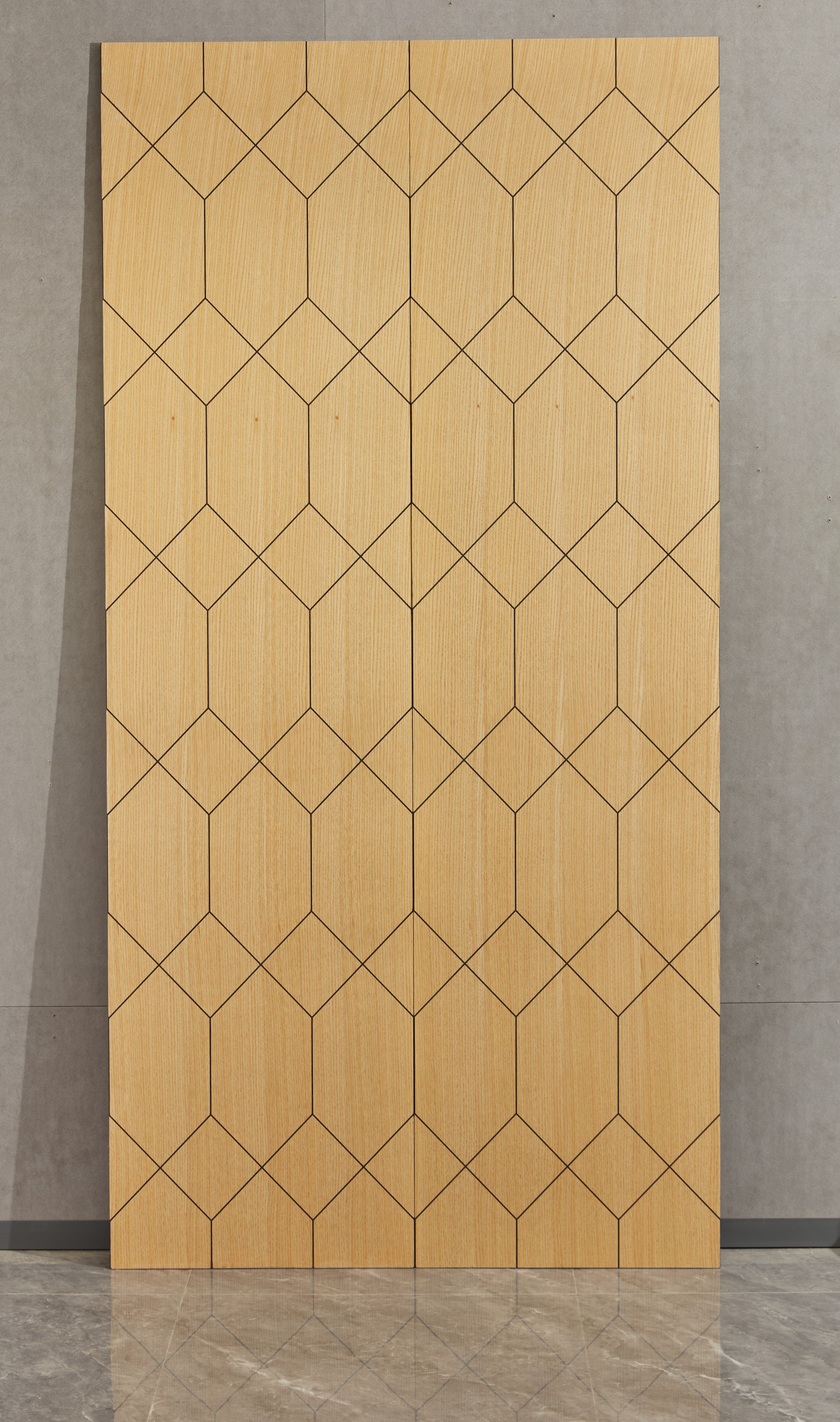 Two geometric bambu wall panels by Element, leaning against a wall.
