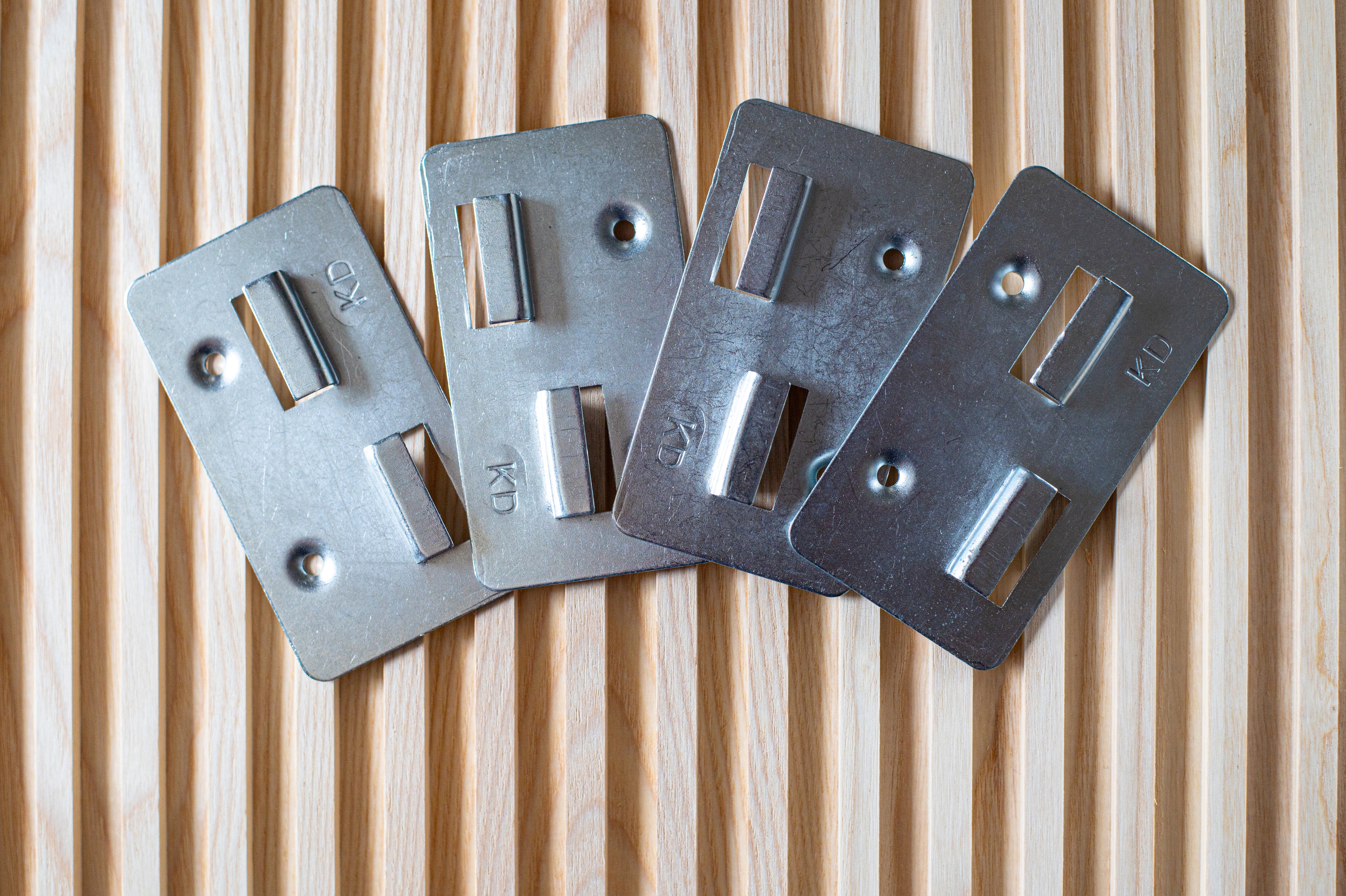 Close up metal fixings of fluted wall panel by Element