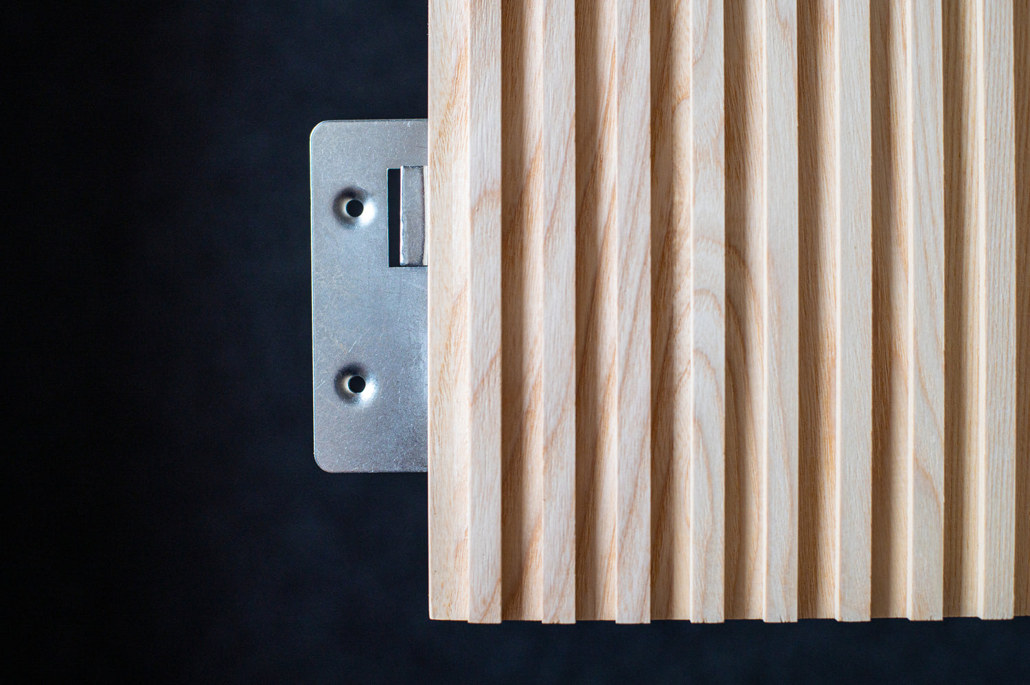 Close up metal fixing of fluted wall panel by Element