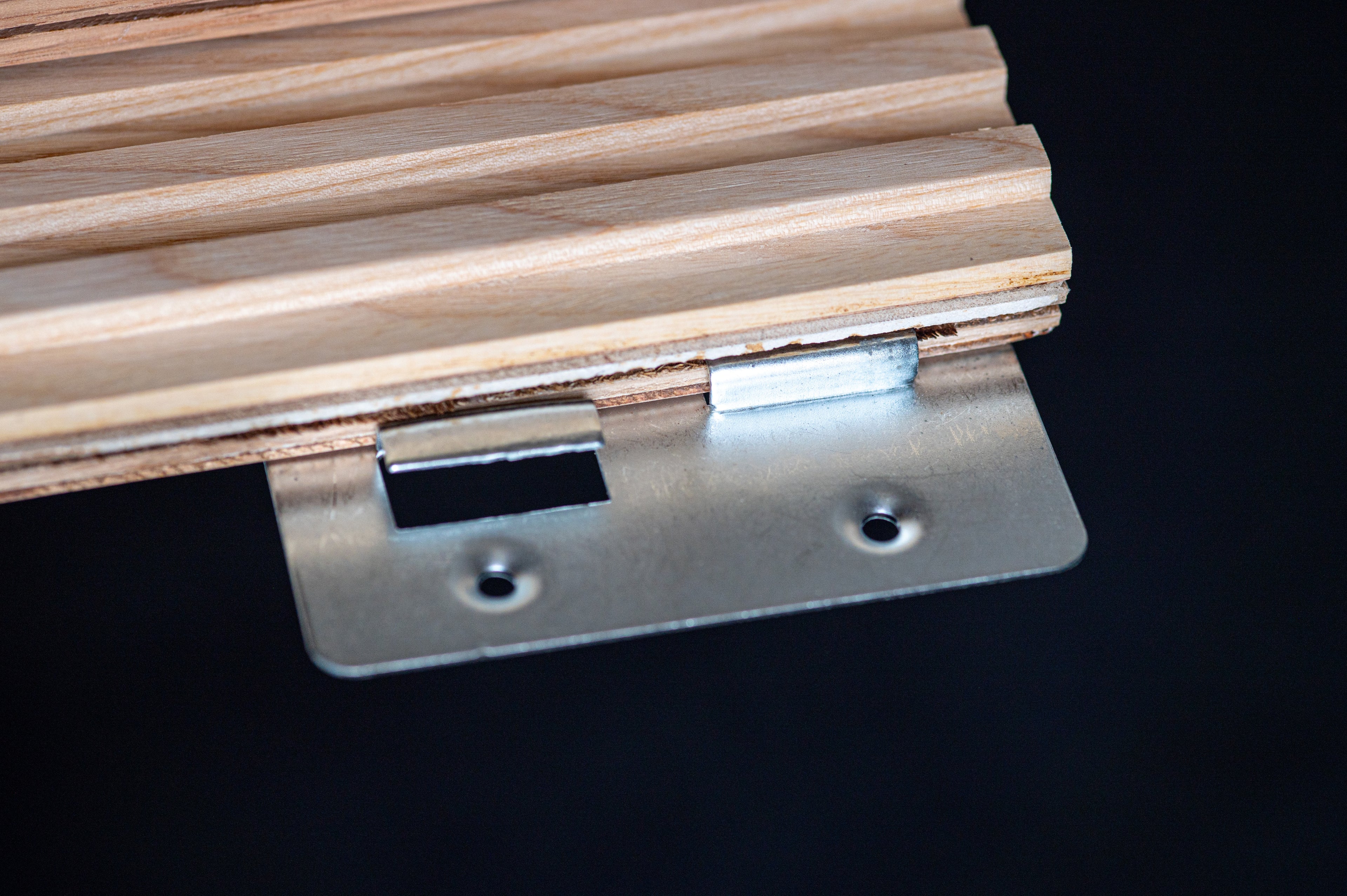 Close up metal fixing of fluted wall panel by Element