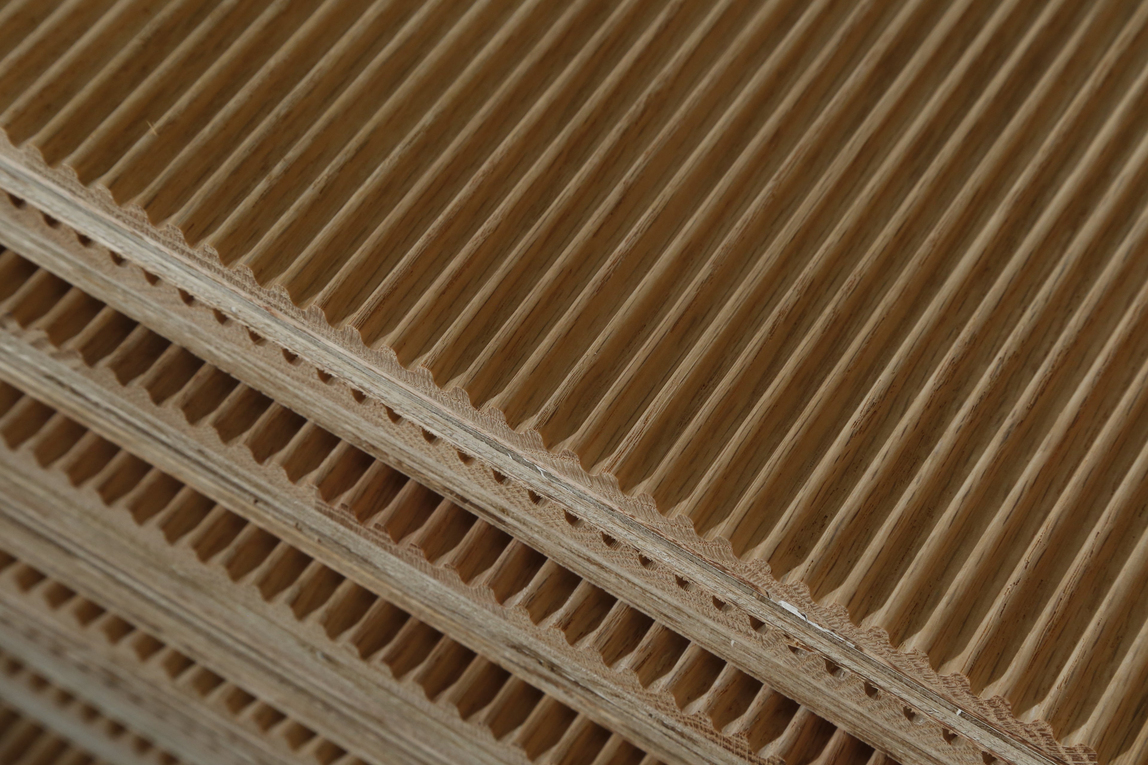 Close up of multiple Oak Curved Fluted Wall Panels. Made By Element Process